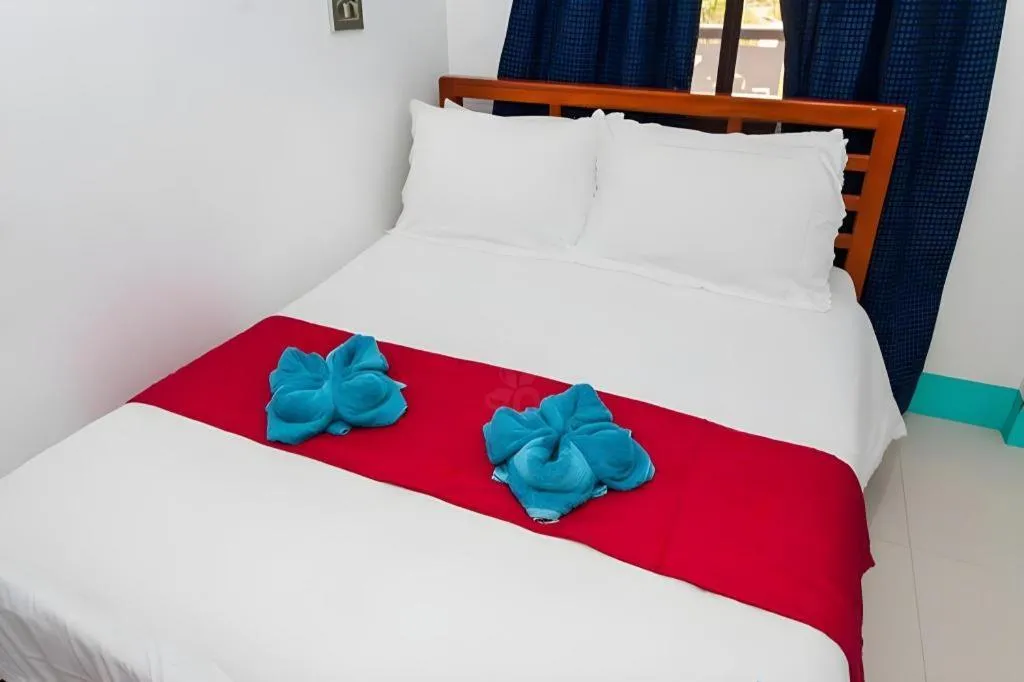 Bed in Palm Grove Saud Holiday Complex Hotel