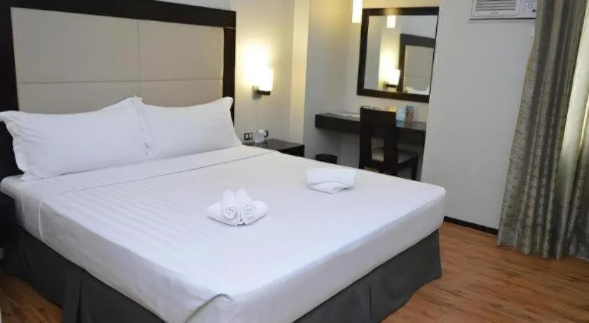 Bed in Mallberry Suites Business Hotel