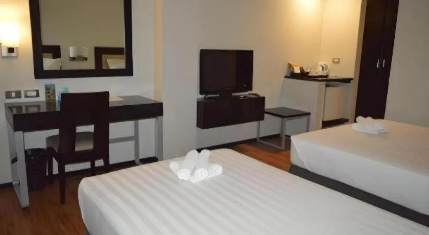 Bed in Mallberry Suites Business Hotel