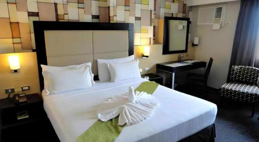 Bed in Mallberry Suites Business Hotel