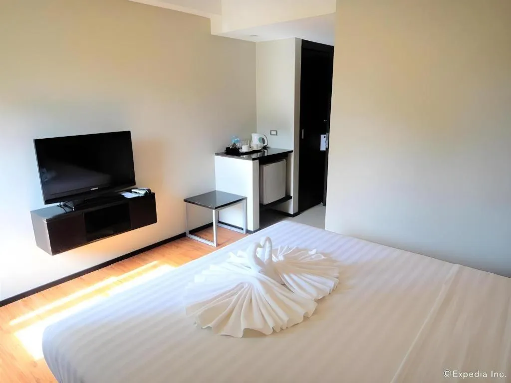 Bed in Mallberry Suites Business Hotel