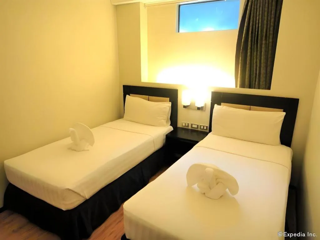Bed in Mallberry Suites Business Hotel