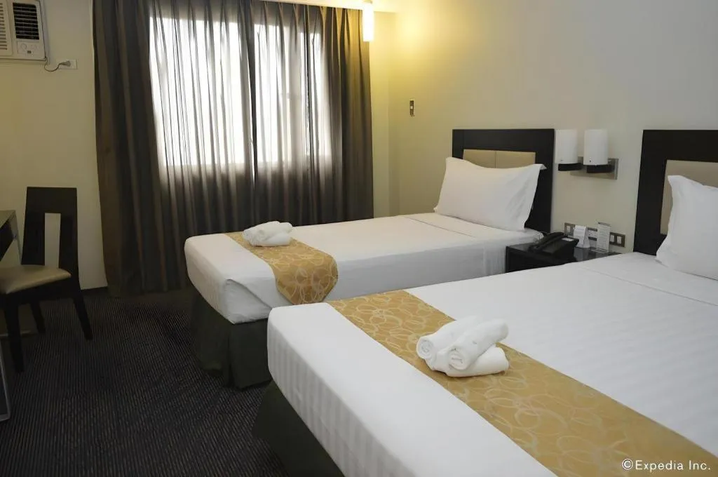 Bed in Mallberry Suites Business Hotel