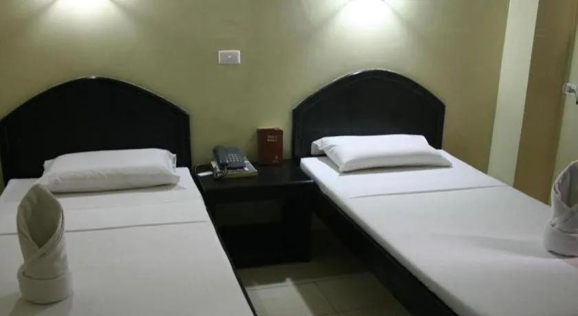 Bed in Sampaguita Suites Plaza Garcia