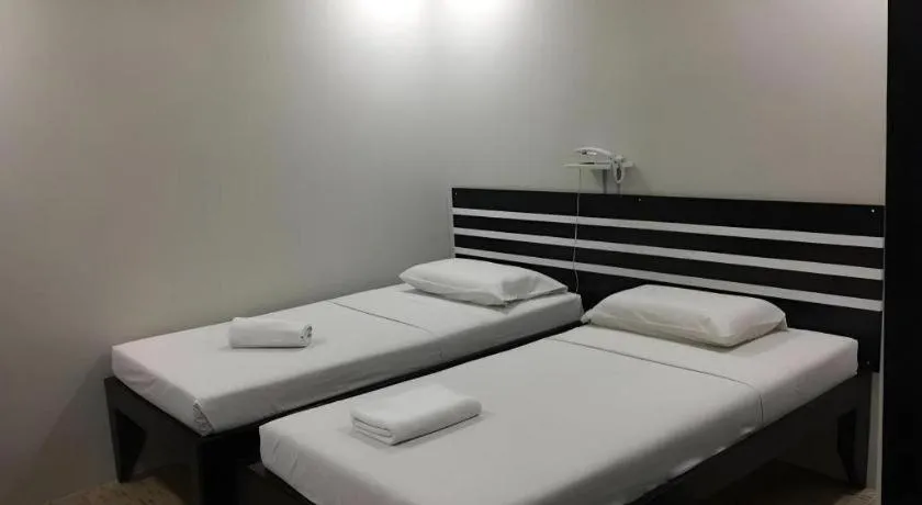 Bed in Sampaguita Suites Plaza Garcia