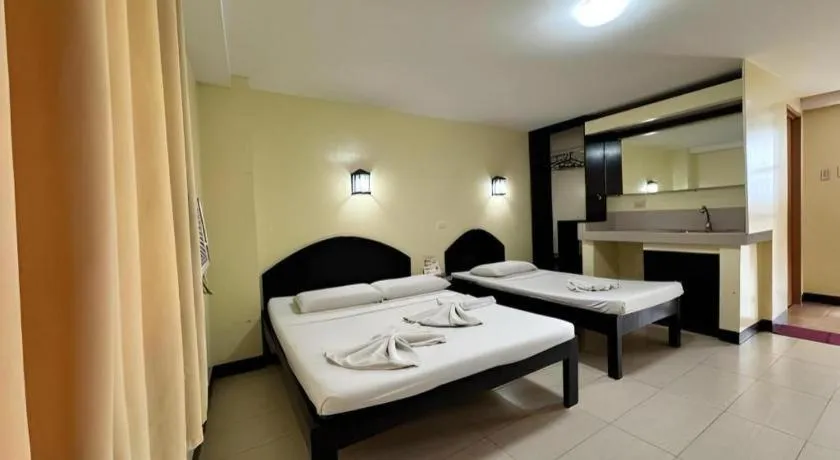 Bed in Sampaguita Suites Plaza Garcia