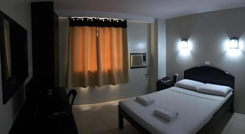 Bed in Sampaguita Suites Plaza Garcia