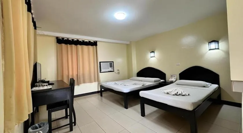 Bed in Sampaguita Suites Plaza Garcia