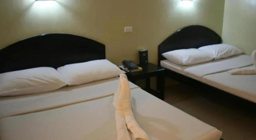 Bed in Sampaguita Suites Plaza Garcia