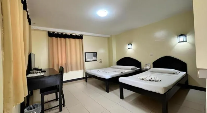 Bed in Sampaguita Suites Plaza Garcia
