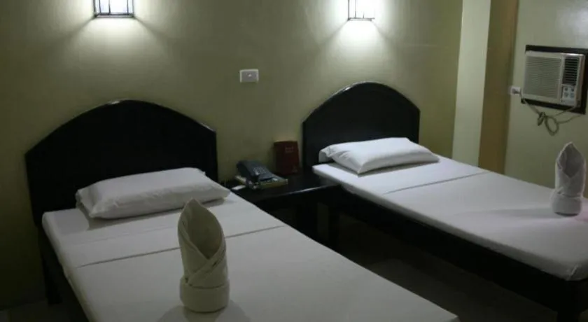Bed in Sampaguita Suites Plaza Garcia