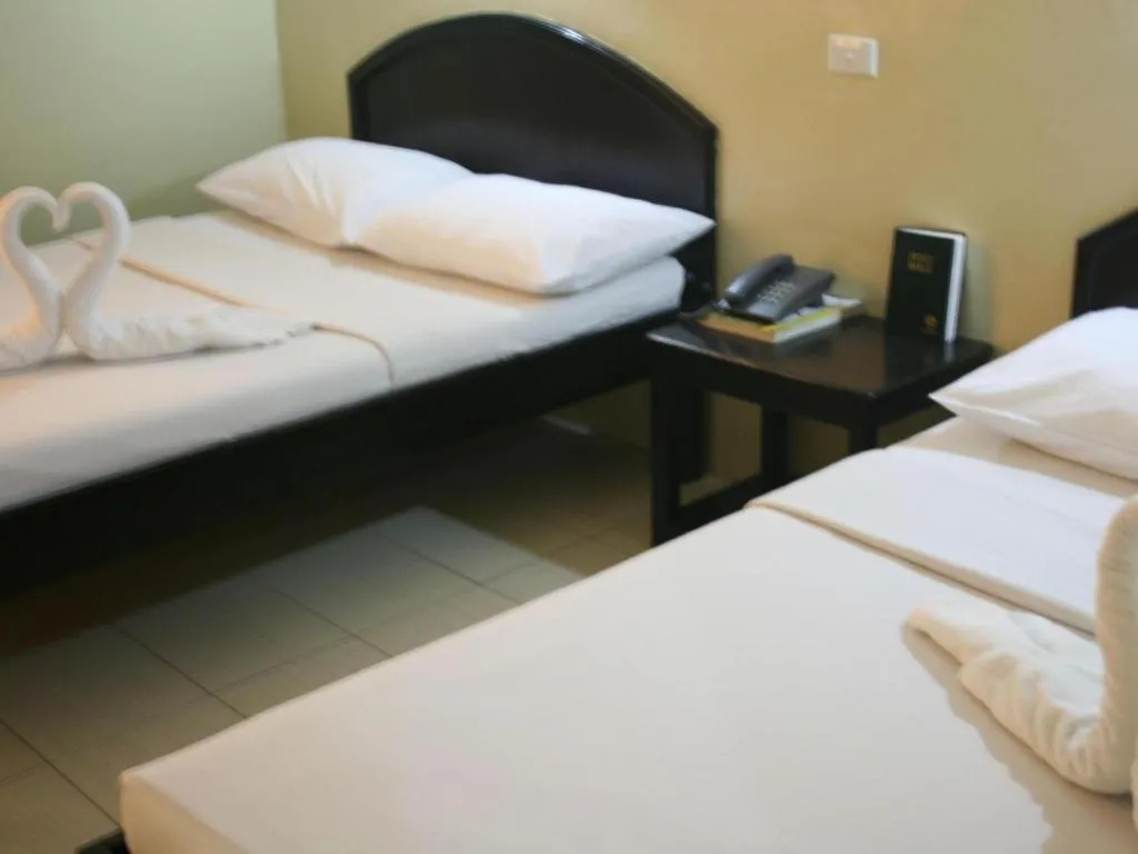 Bed in Sampaguita Suites Plaza Garcia