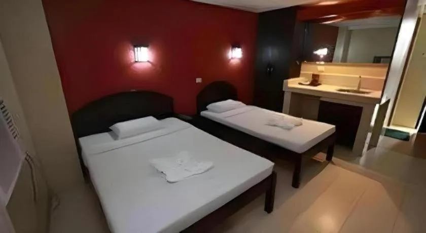 Bed in Sampaguita Suites Plaza Garcia
