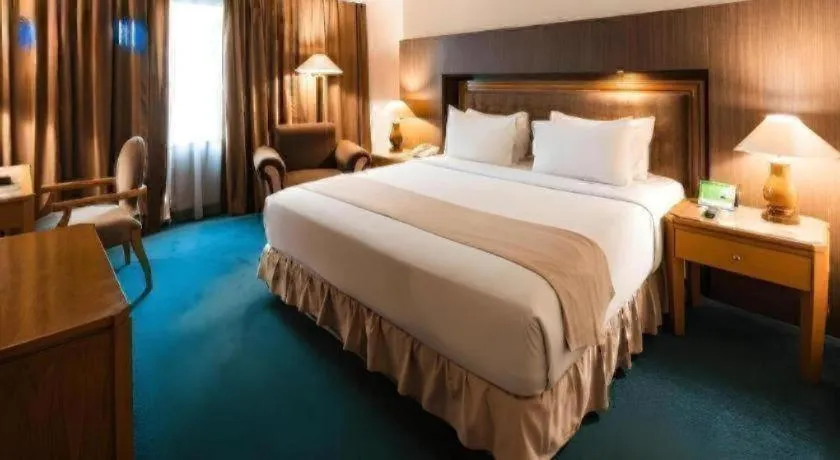 Bed in Oasis Amir Hotel