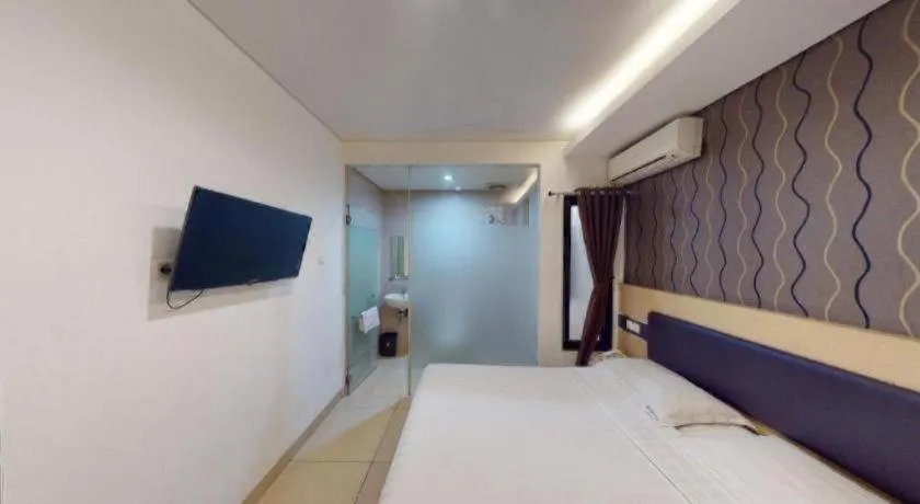 Bed in Sumi Hotel Simpang Lima Semarang