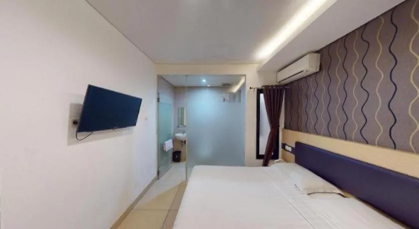 Bed in Sumi Hotel Simpang Lima Semarang