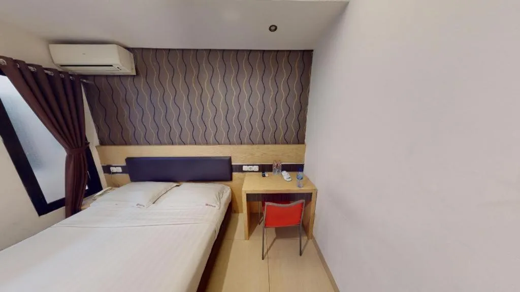 Bed in Sumi Hotel Simpang Lima Semarang