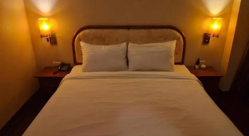 Bed in Western Grand Hotel Ratchaburi