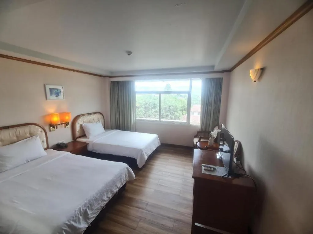 Bed in Western Grand Hotel Ratchaburi