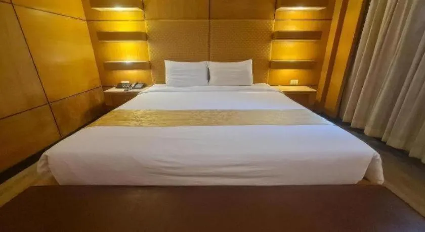 Bed in Western Grand Hotel Ratchaburi