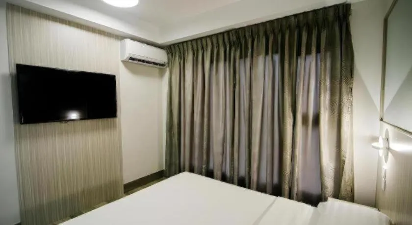 Bed in Travelite Express Hotel