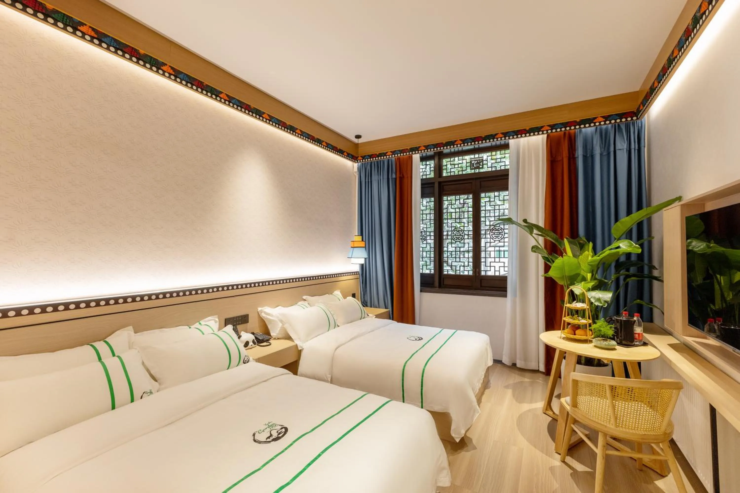 Photo of the whole room, Bed in Xishu Garden Inn - Travel Agency service - Car Rent service - English Speaking