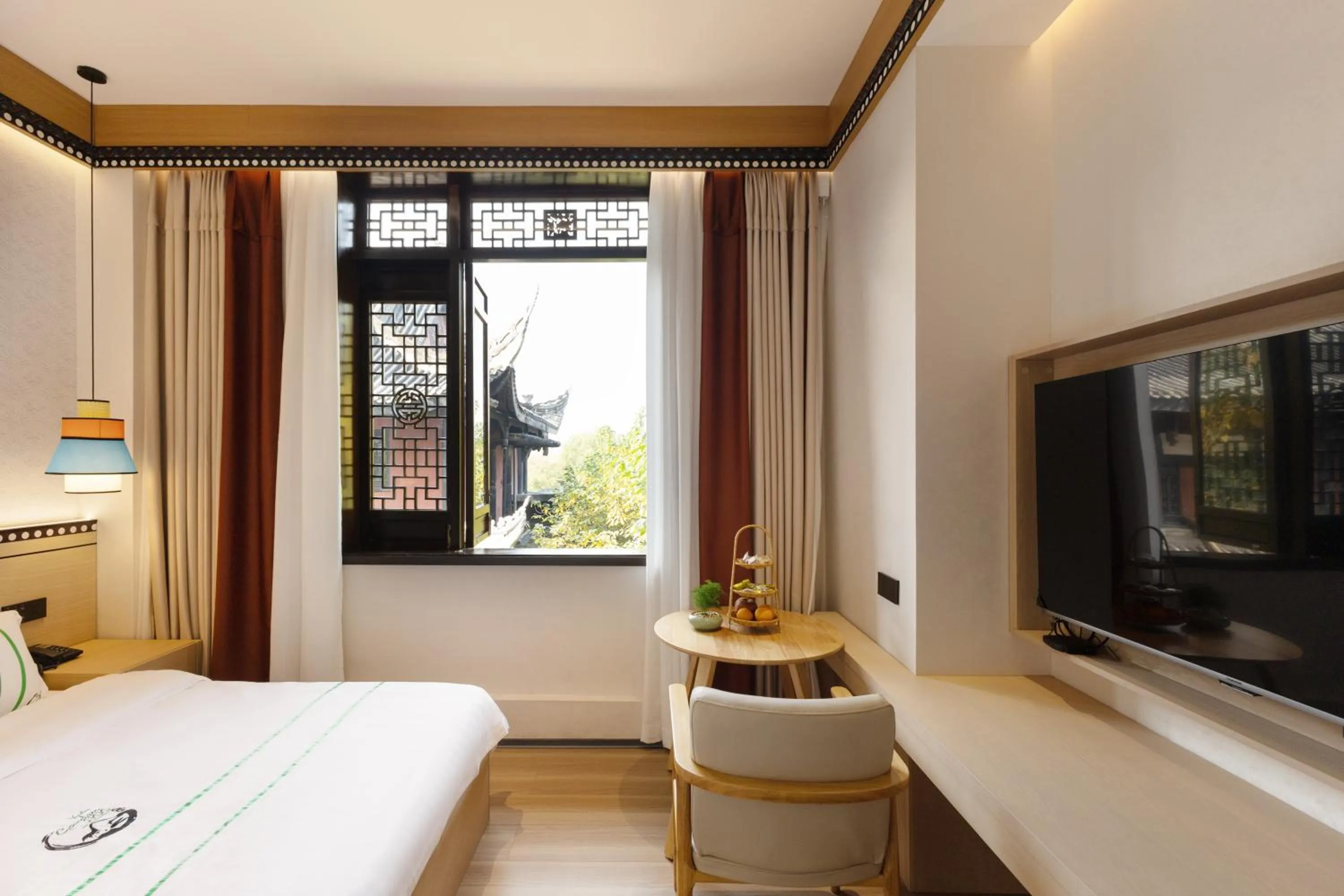 Photo of the whole room, Bed in Xishu Garden Inn - Travel Agency service - Car Rent service - English Speaking