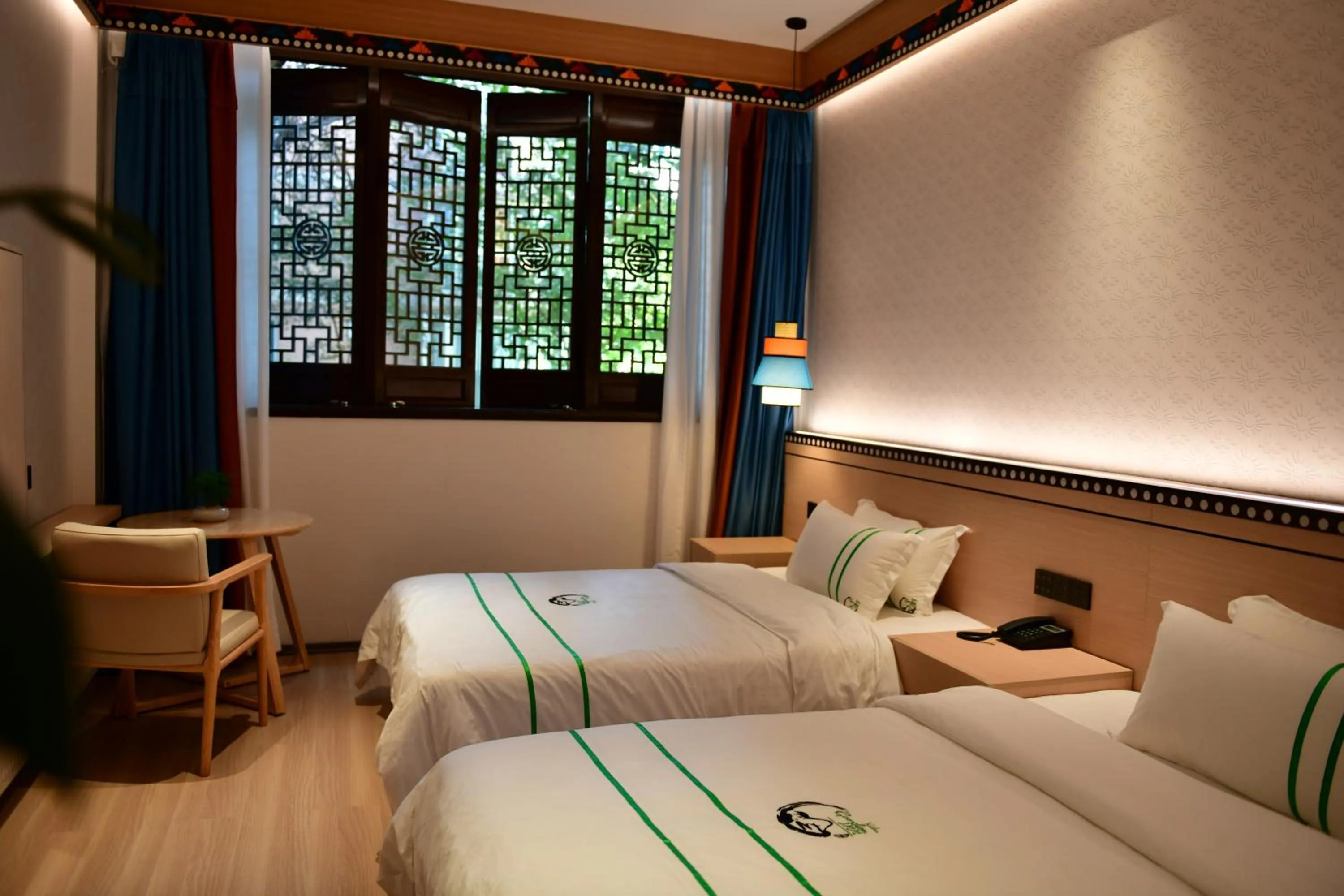Photo of the whole room, Bed in Xishu Garden Inn - Travel Agency service - Car Rent service - English Speaking