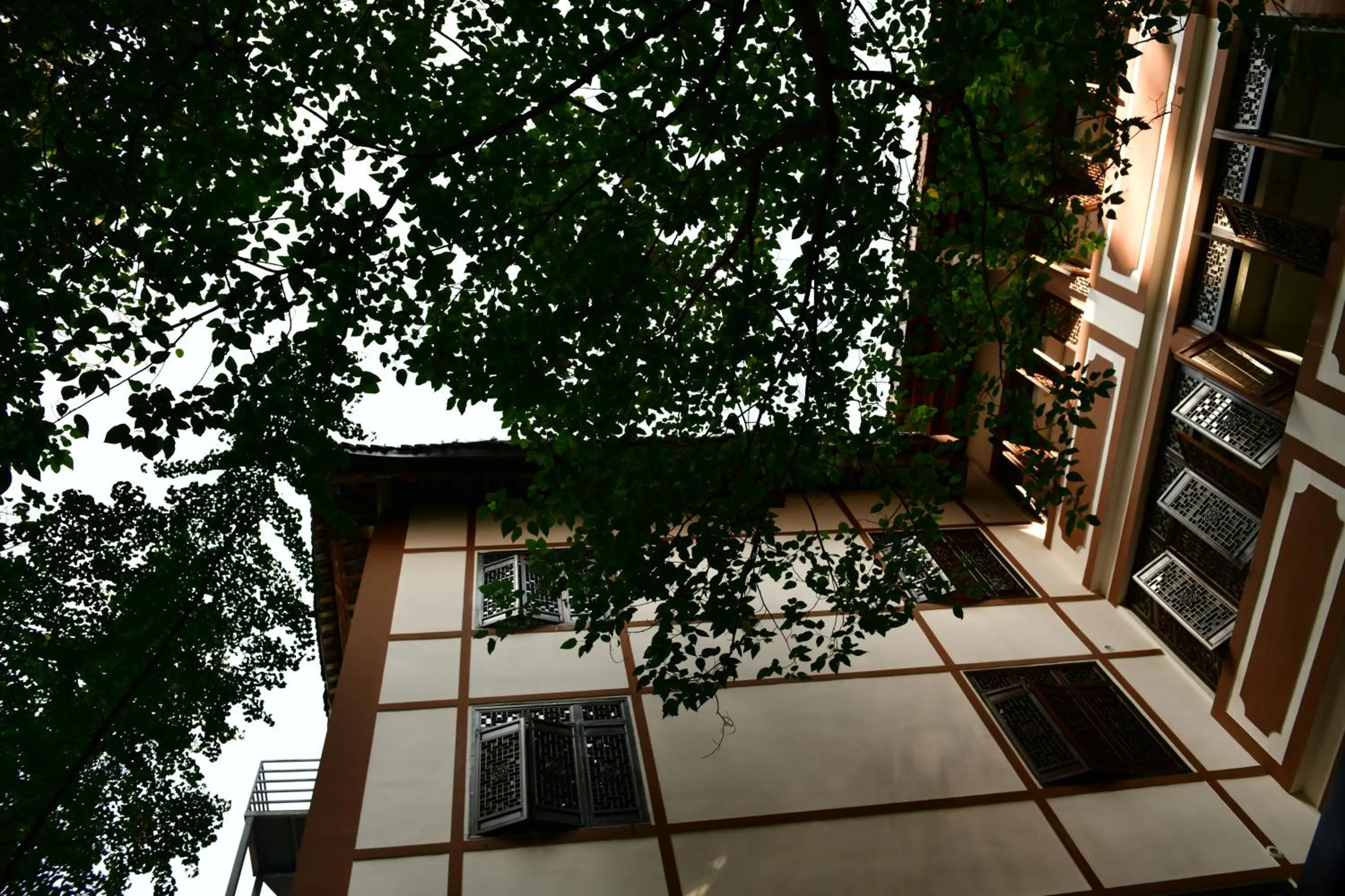 Property building in Xishu Garden Inn - Travel Agency service - Car Rent service - English Speaking