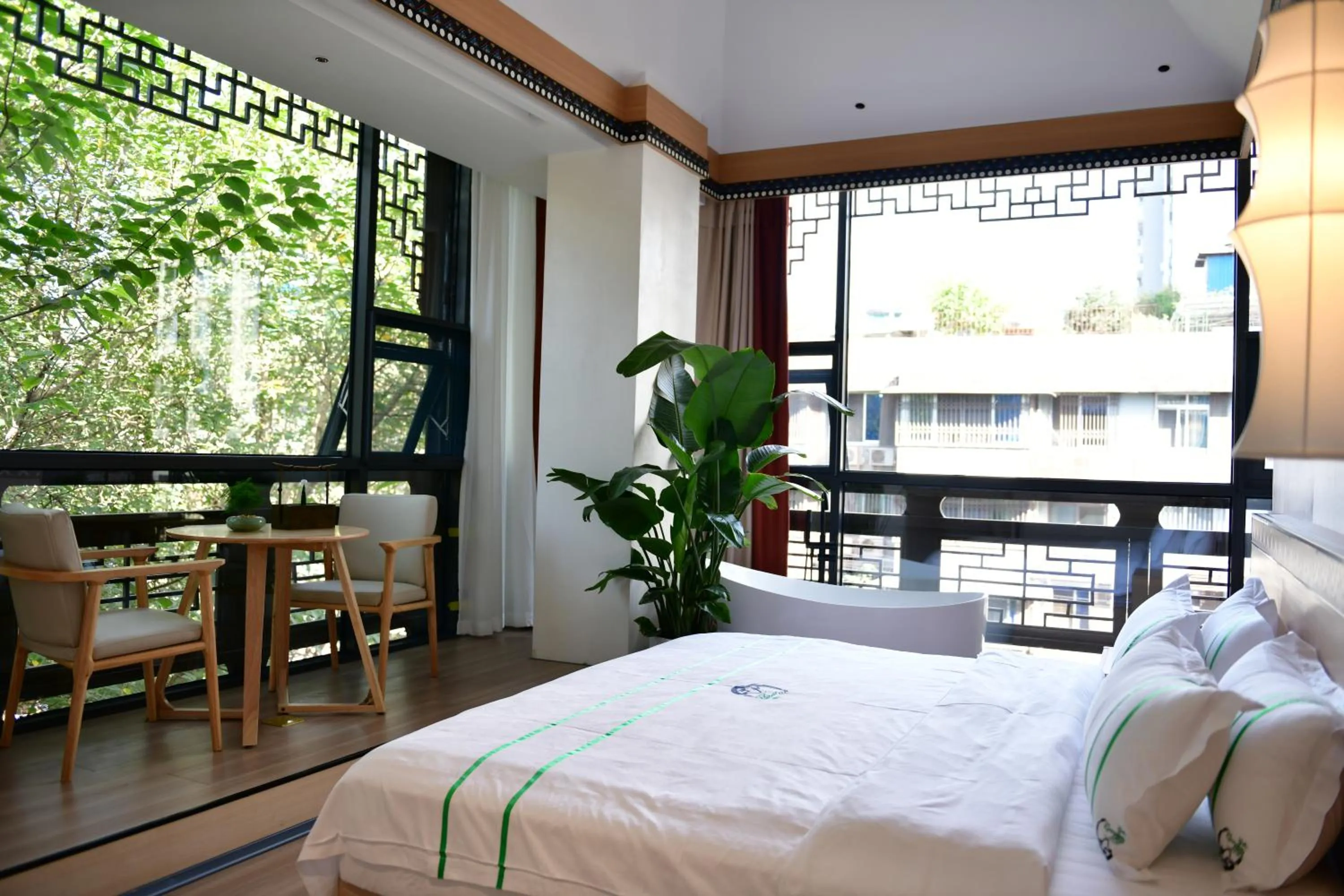 Bed in Xishu Garden Inn - Travel Agency service - Car Rent service - English Speaking