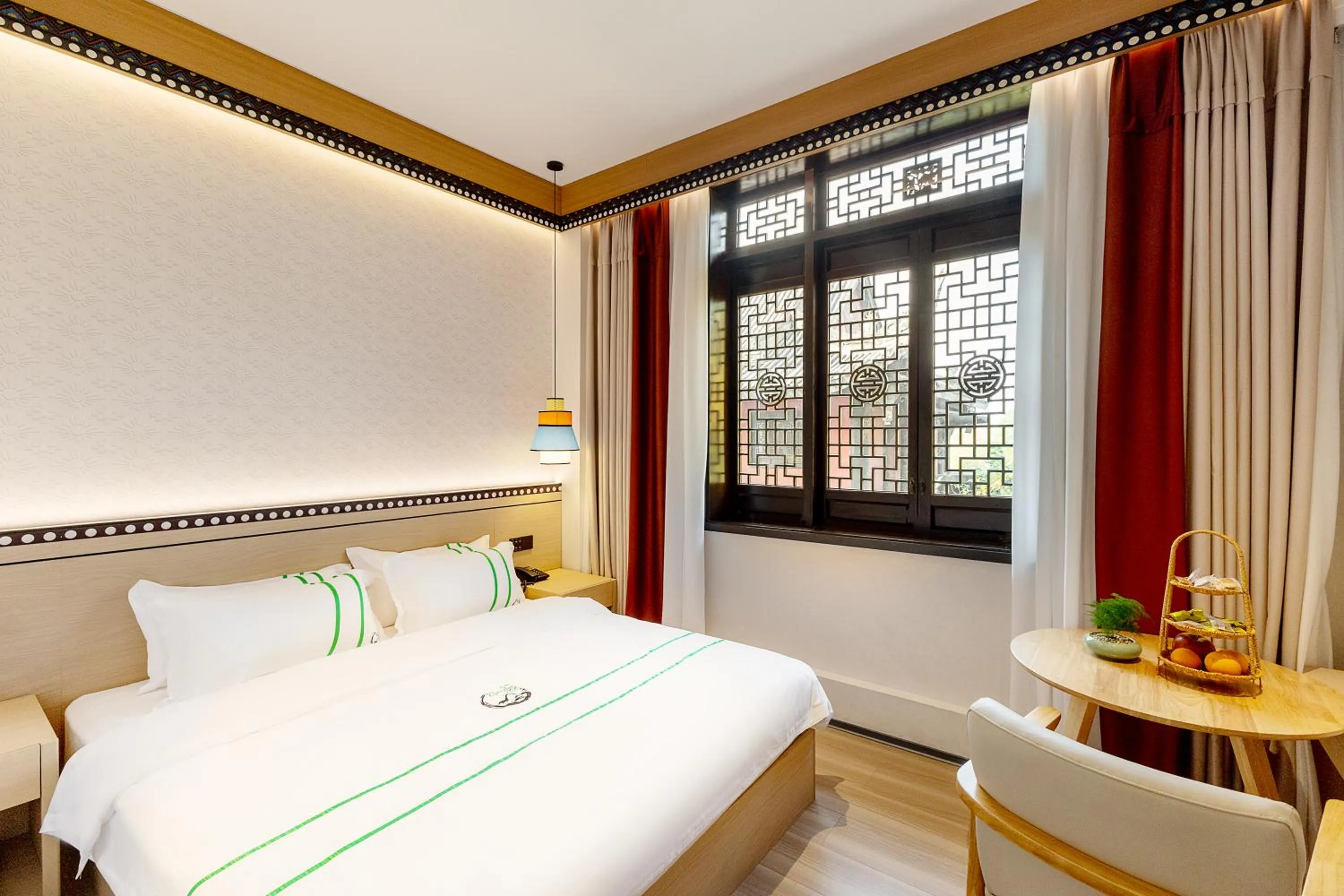 Photo of the whole room, Bed in Xishu Garden Inn - Travel Agency service - Car Rent service - English Speaking