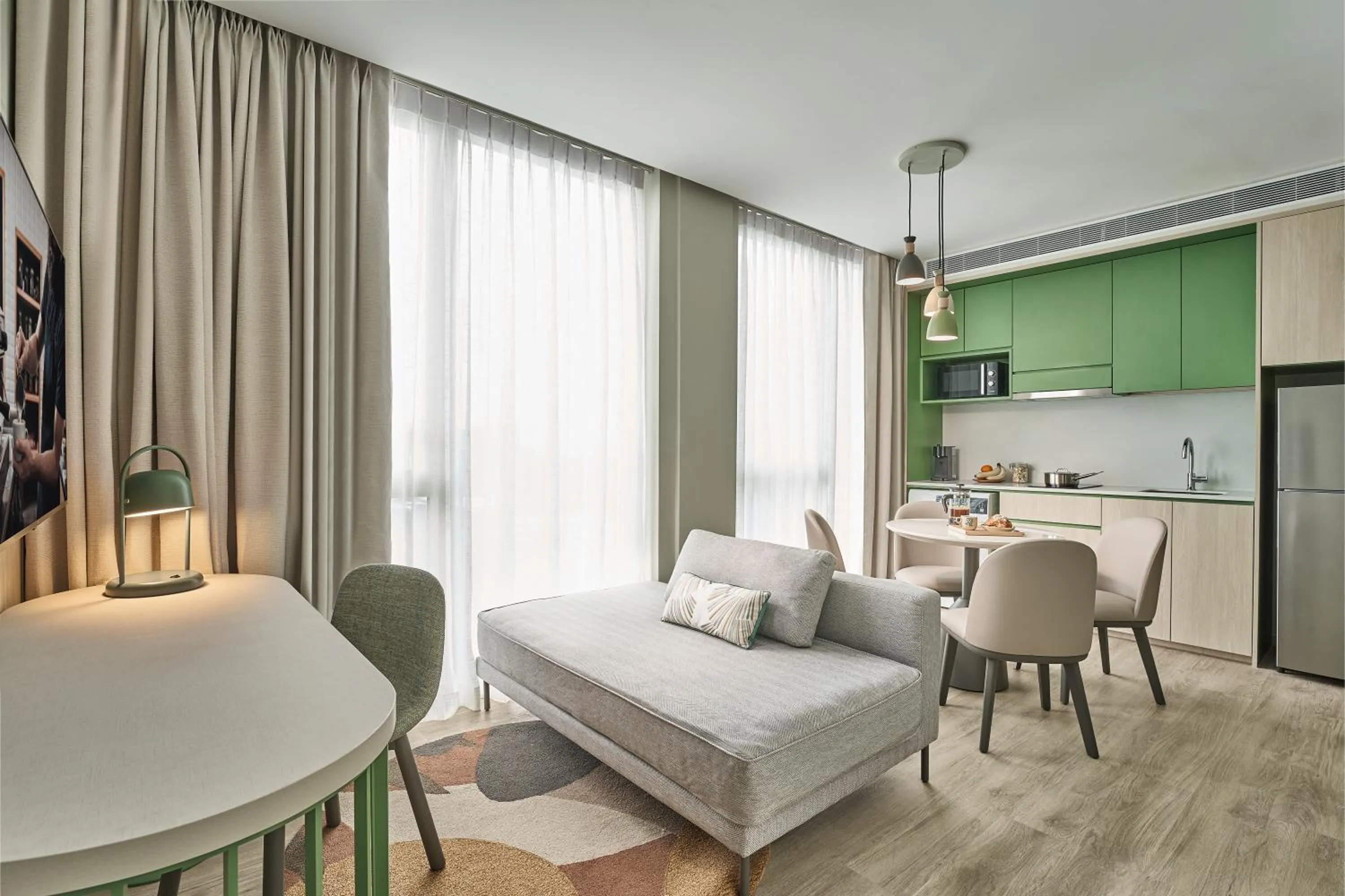 Living room, Bed in Citadines Science Park Singapore