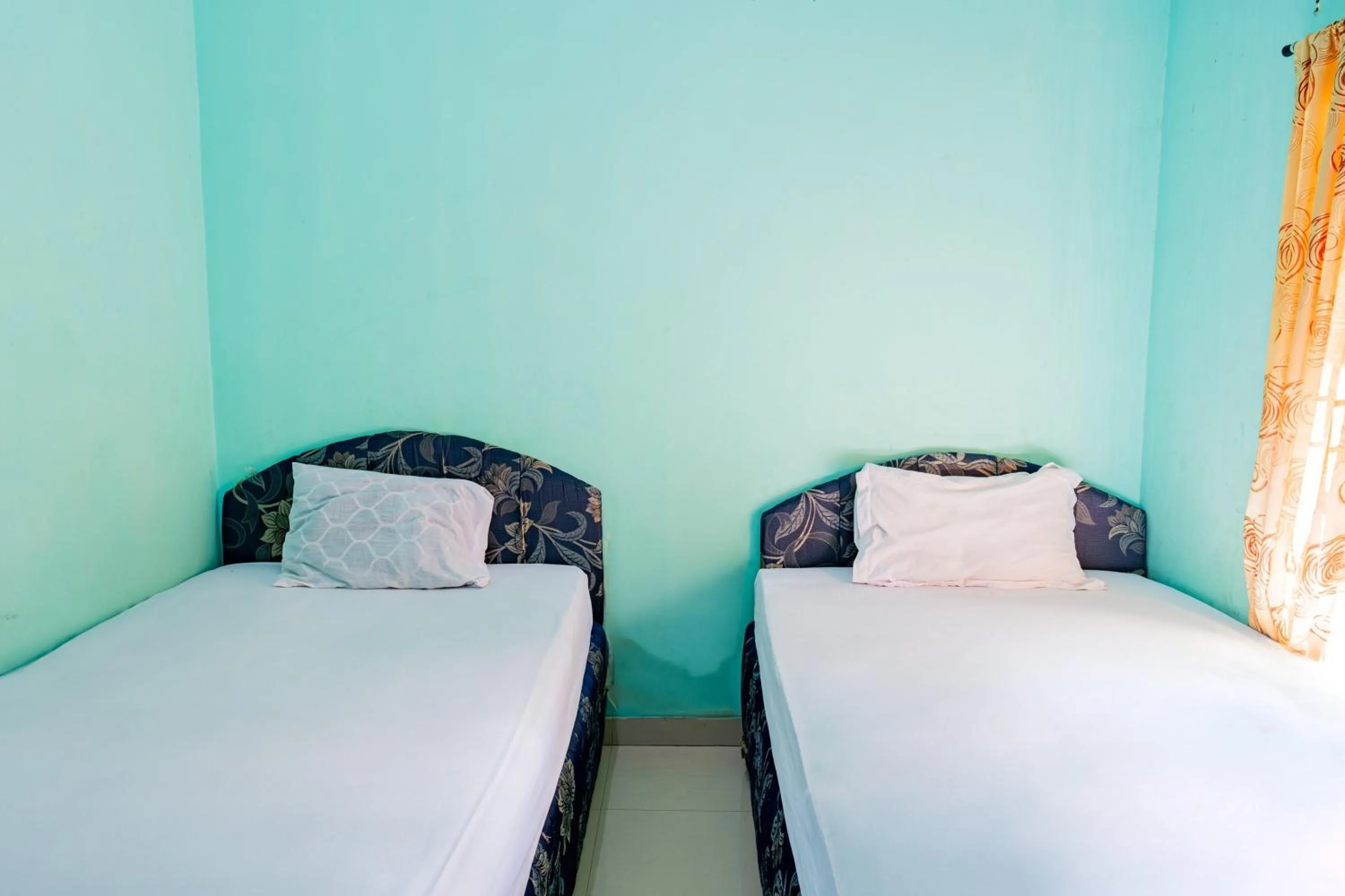 Bedroom in Hotel O Rinjani Guest House