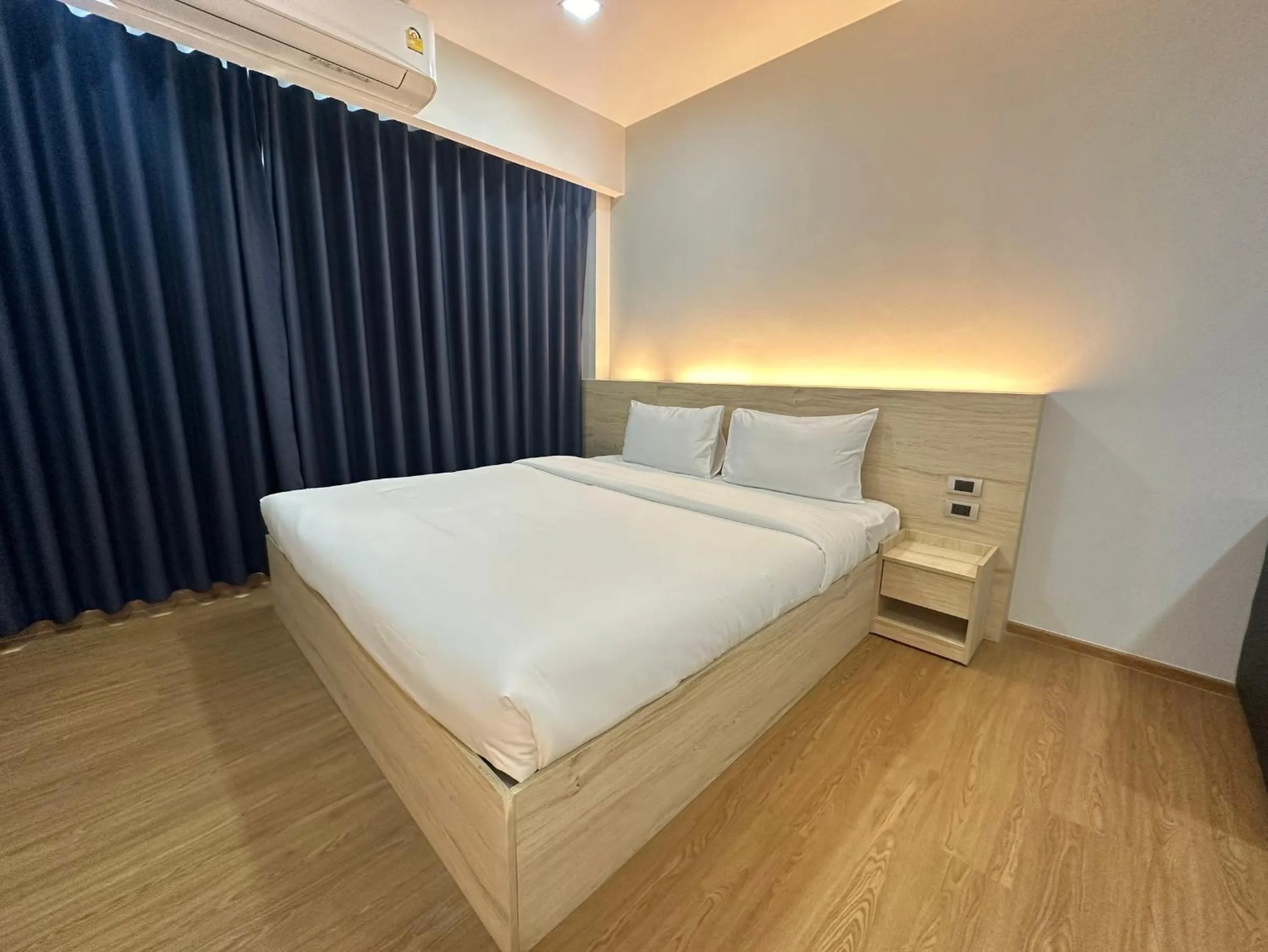 Bed in JIA HAUS Hotel Apartment