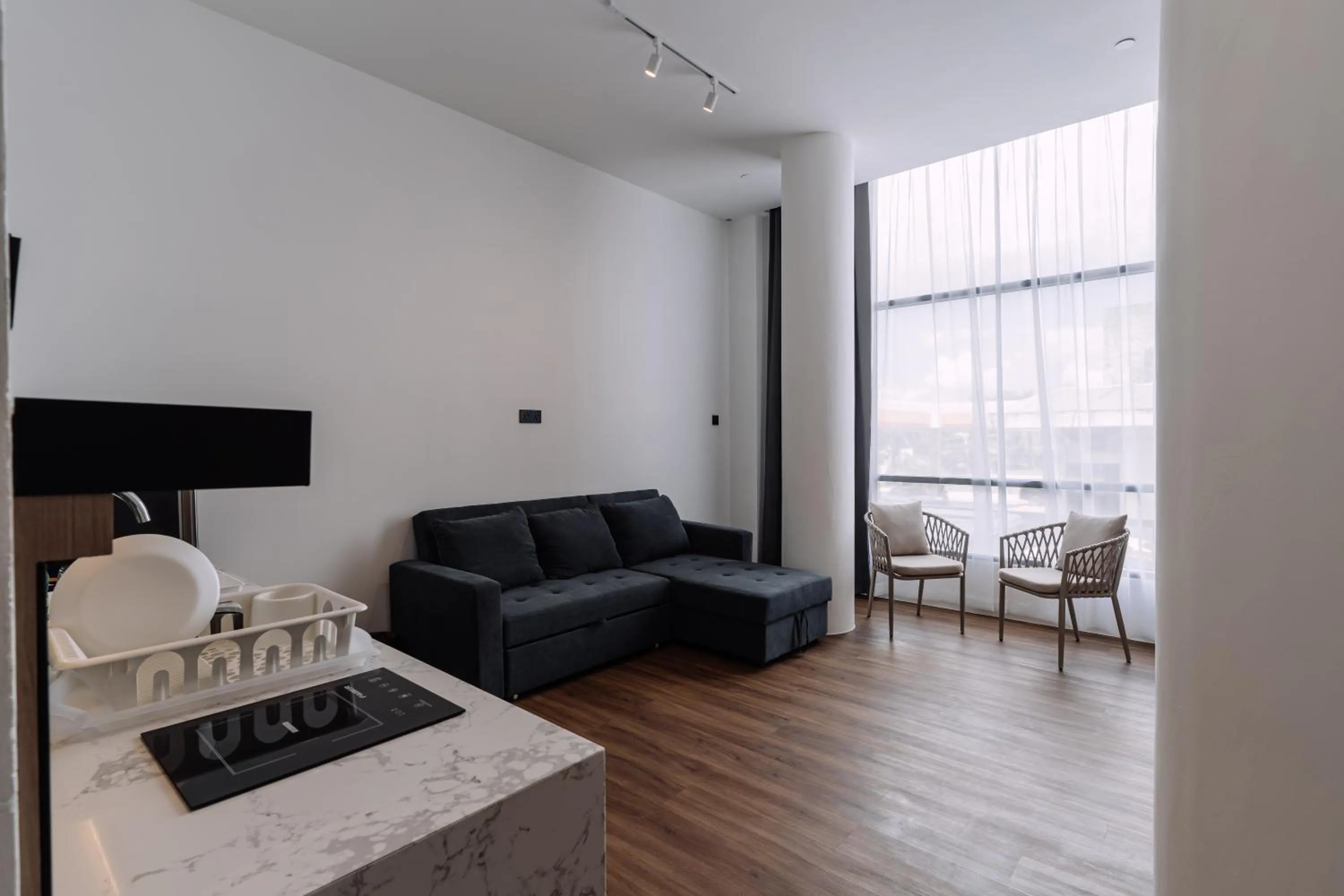 Seating area in Impiana by Roxy Hotel