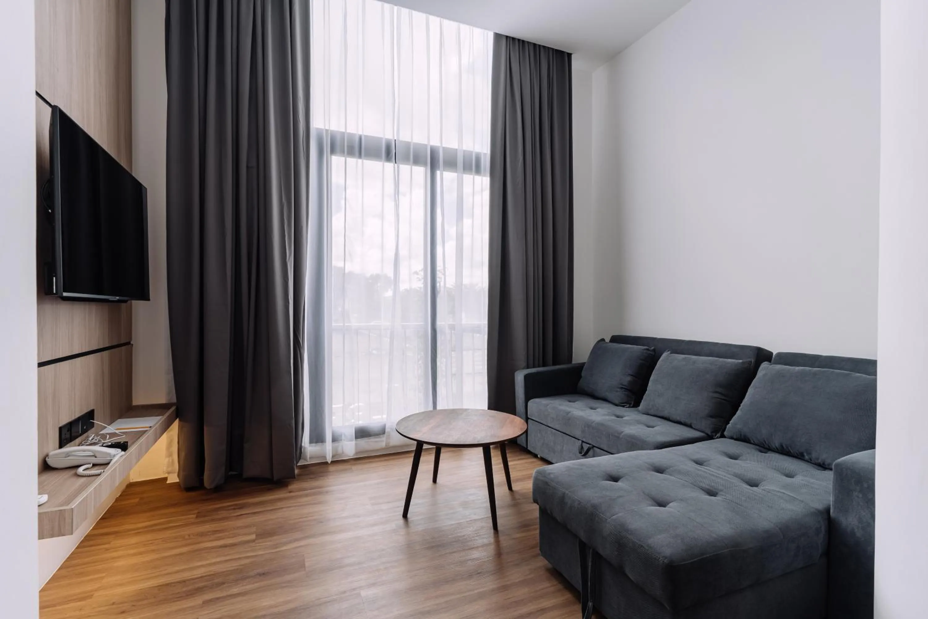 Living room in Impiana by Roxy Hotel