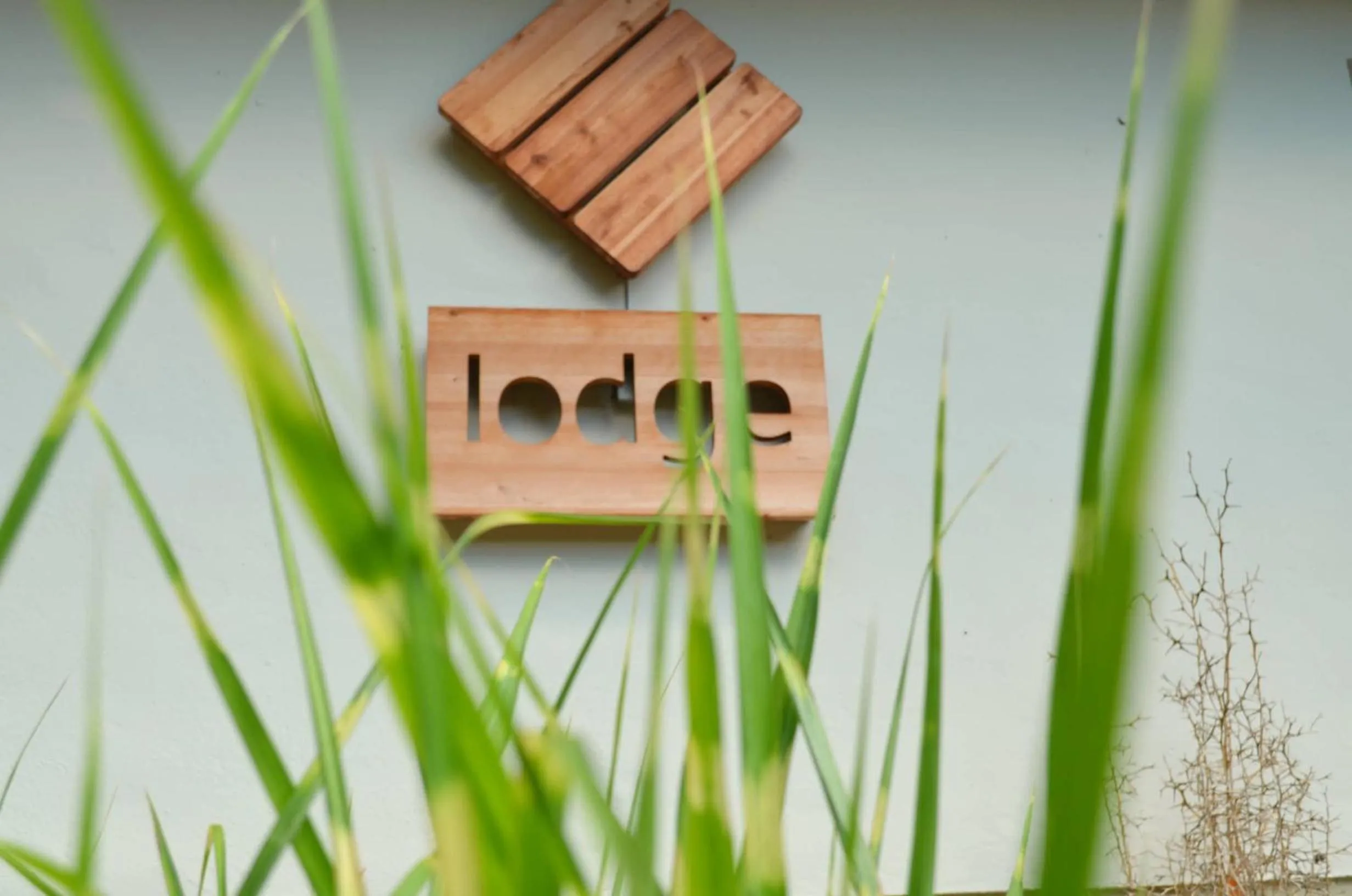 Property logo or sign in Lodge Seaside Boutique Hotel