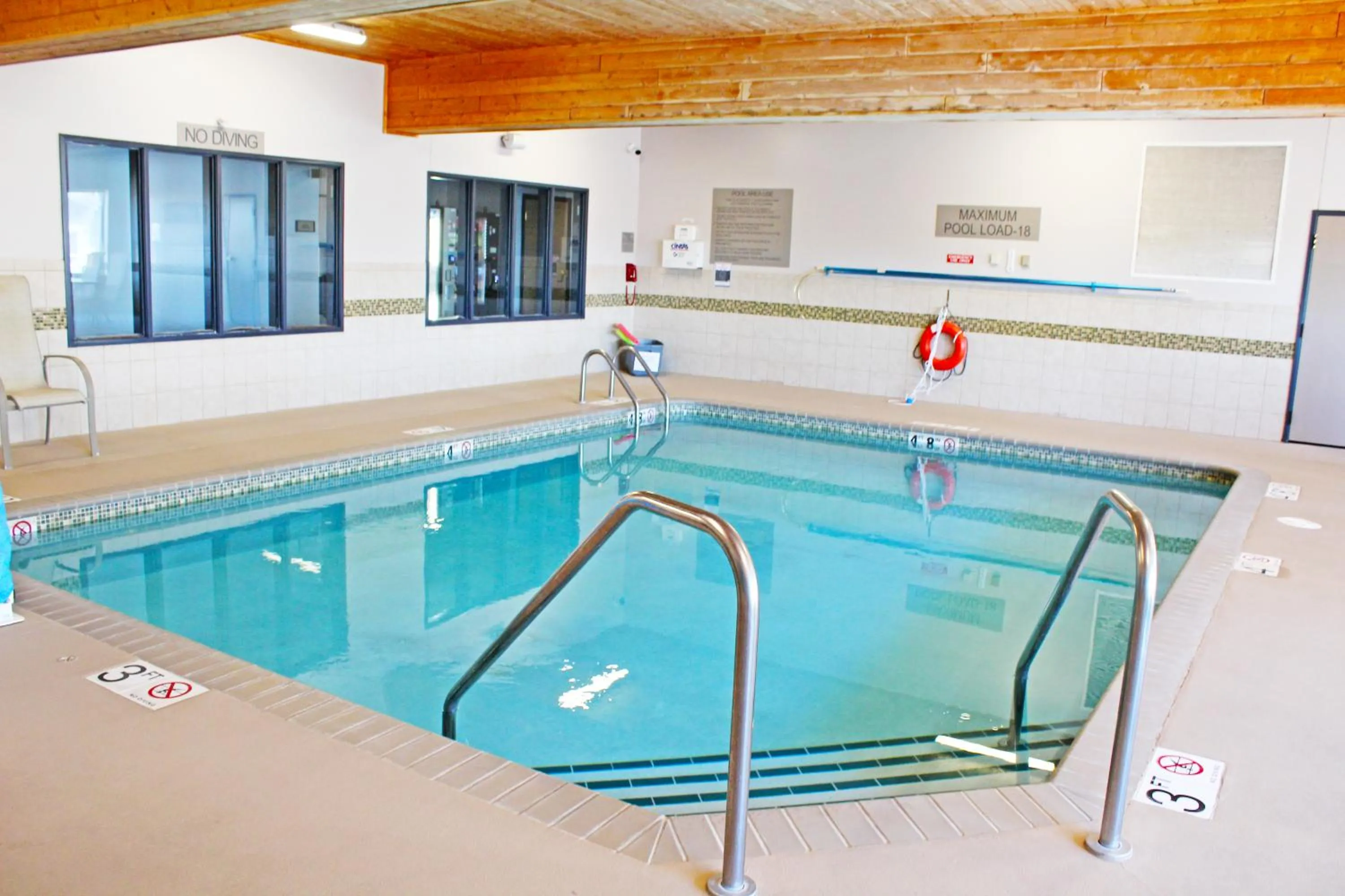 Pool view in Country Inn & Suites by Radisson, Marinette, WI