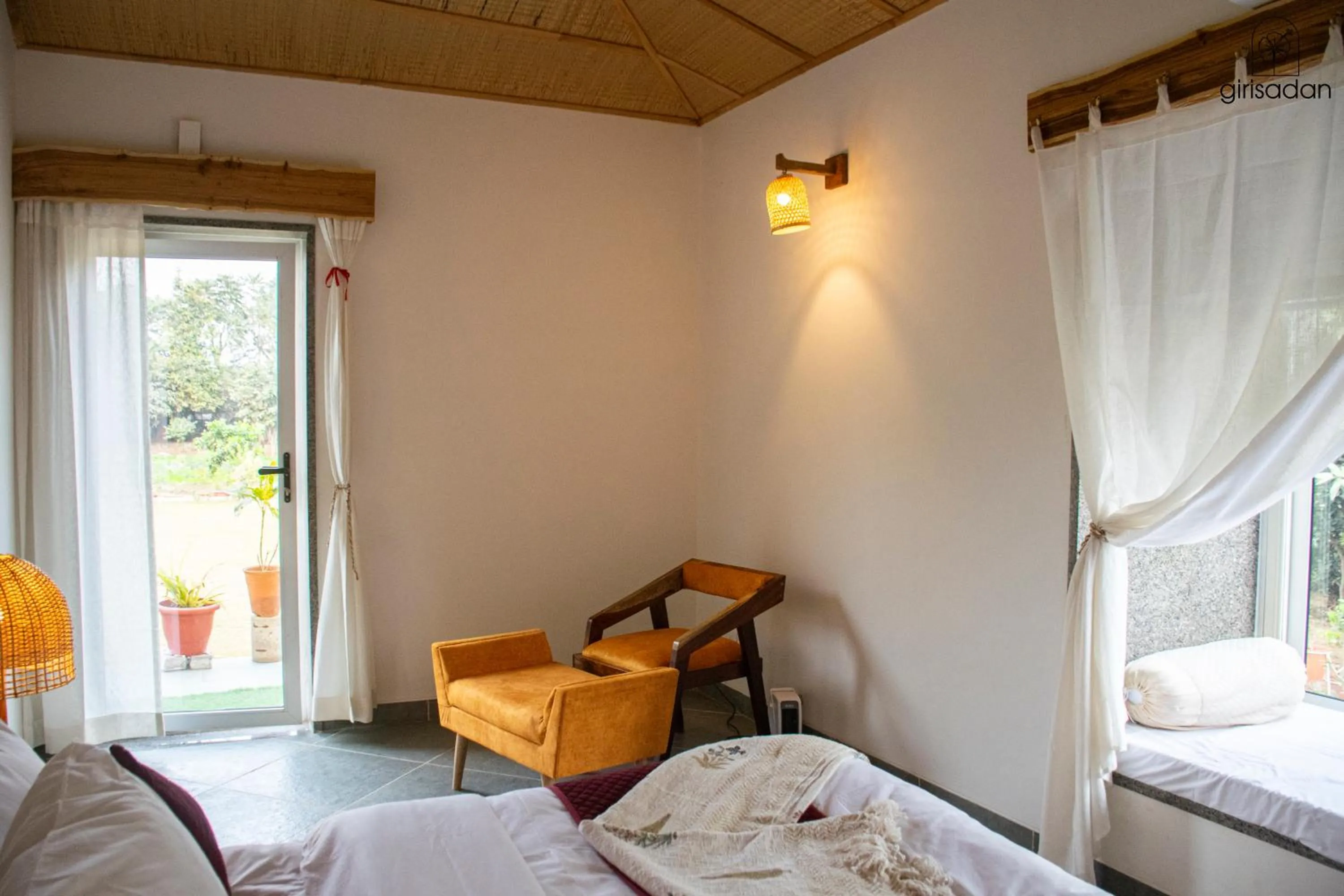 Bed in GiriSadan Organic Retreat & Experiences
