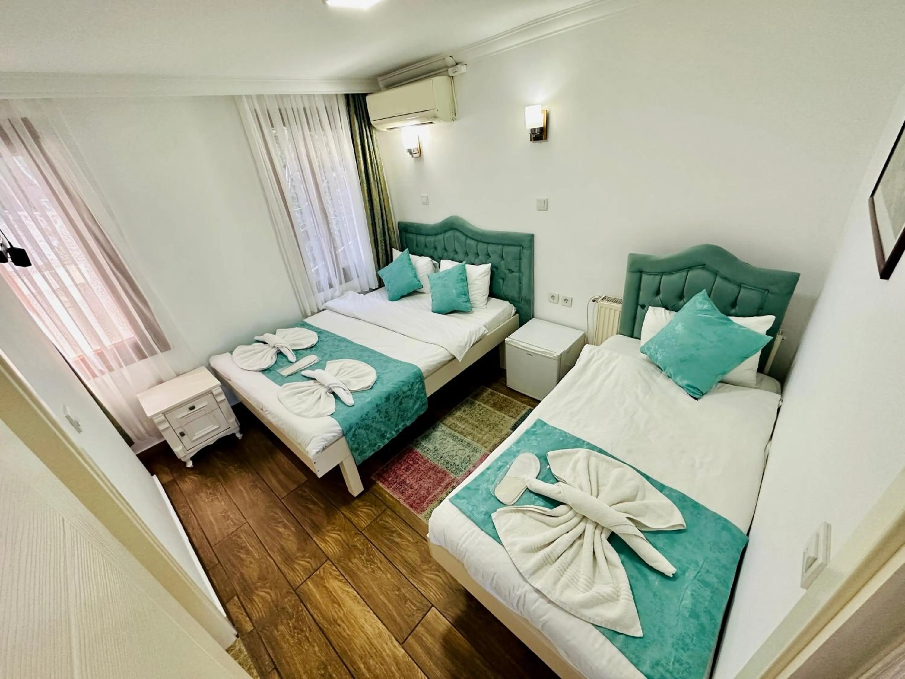 Bed in La Petite Maison Hotel