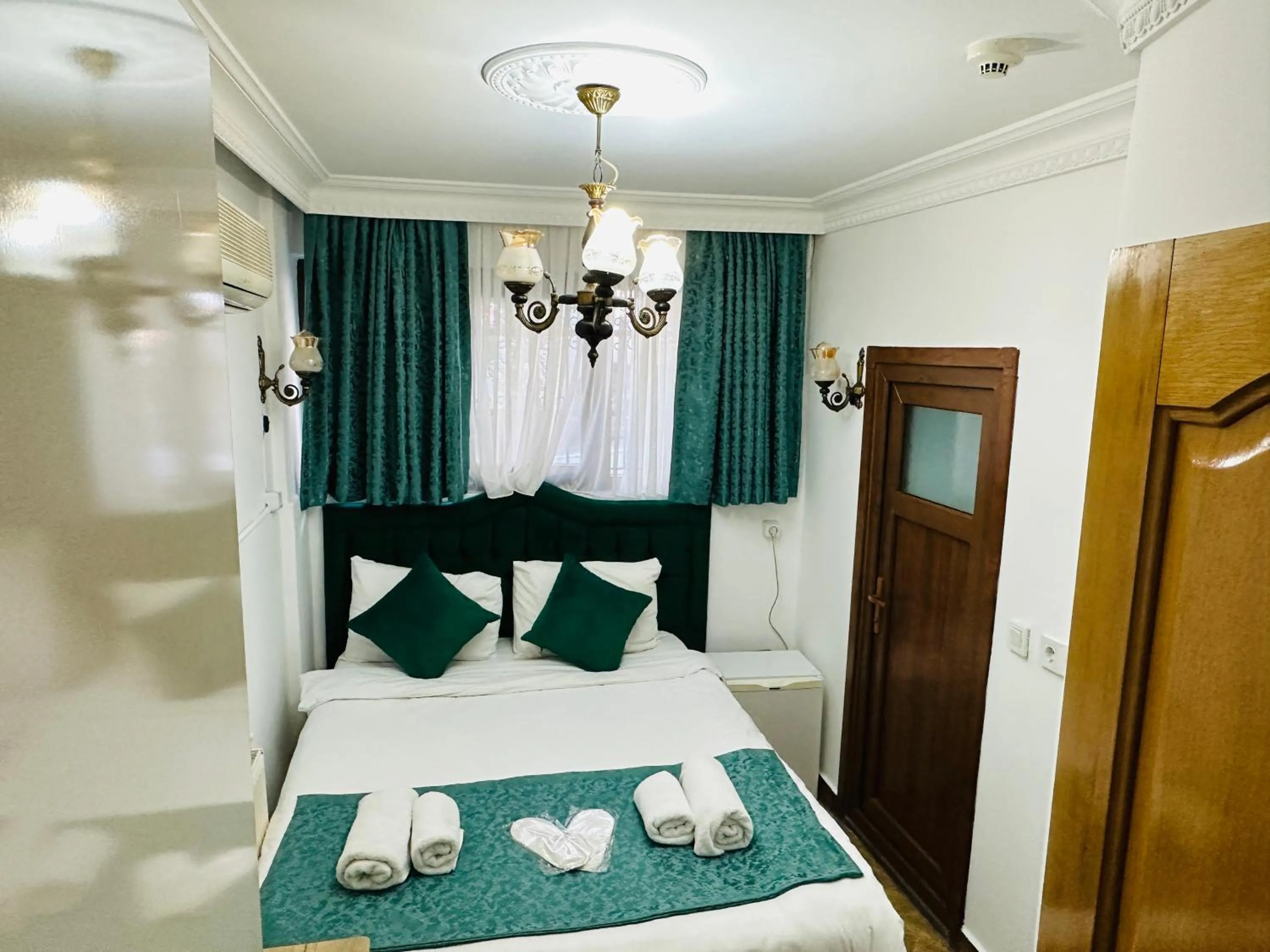 Bed in La Petite Maison Hotel