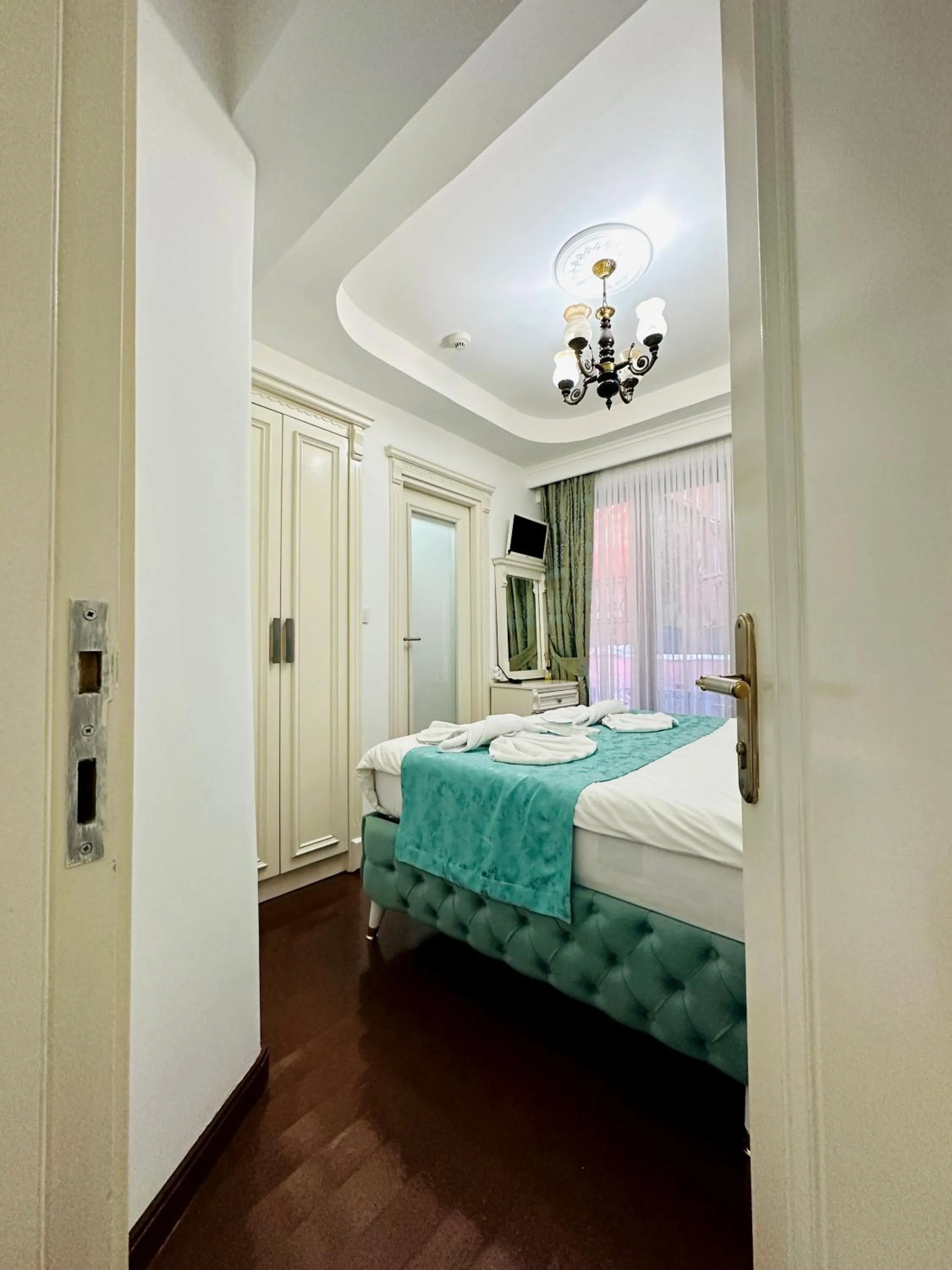 Bed in La Petite Maison Hotel