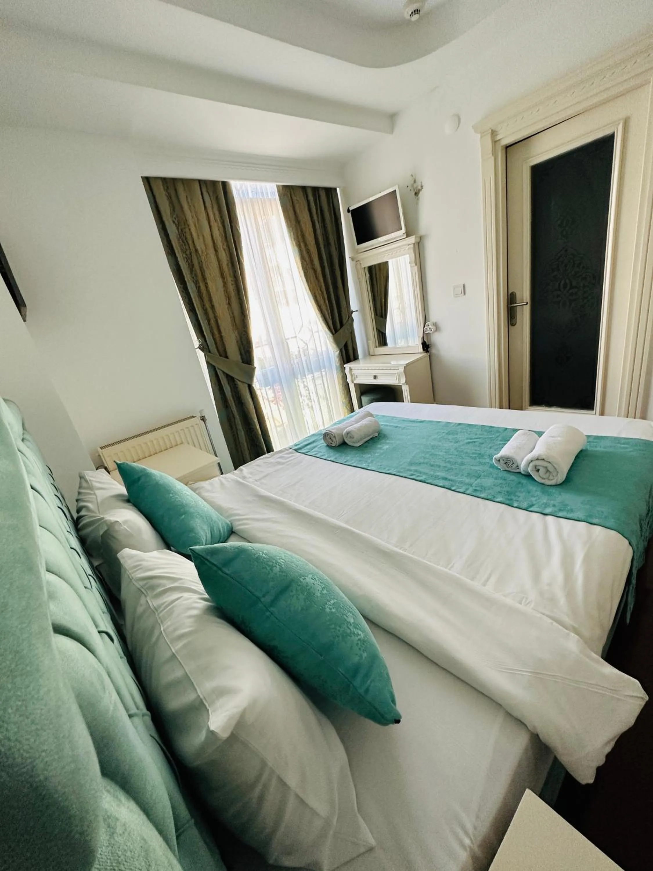 Bed in La Petite Maison Hotel