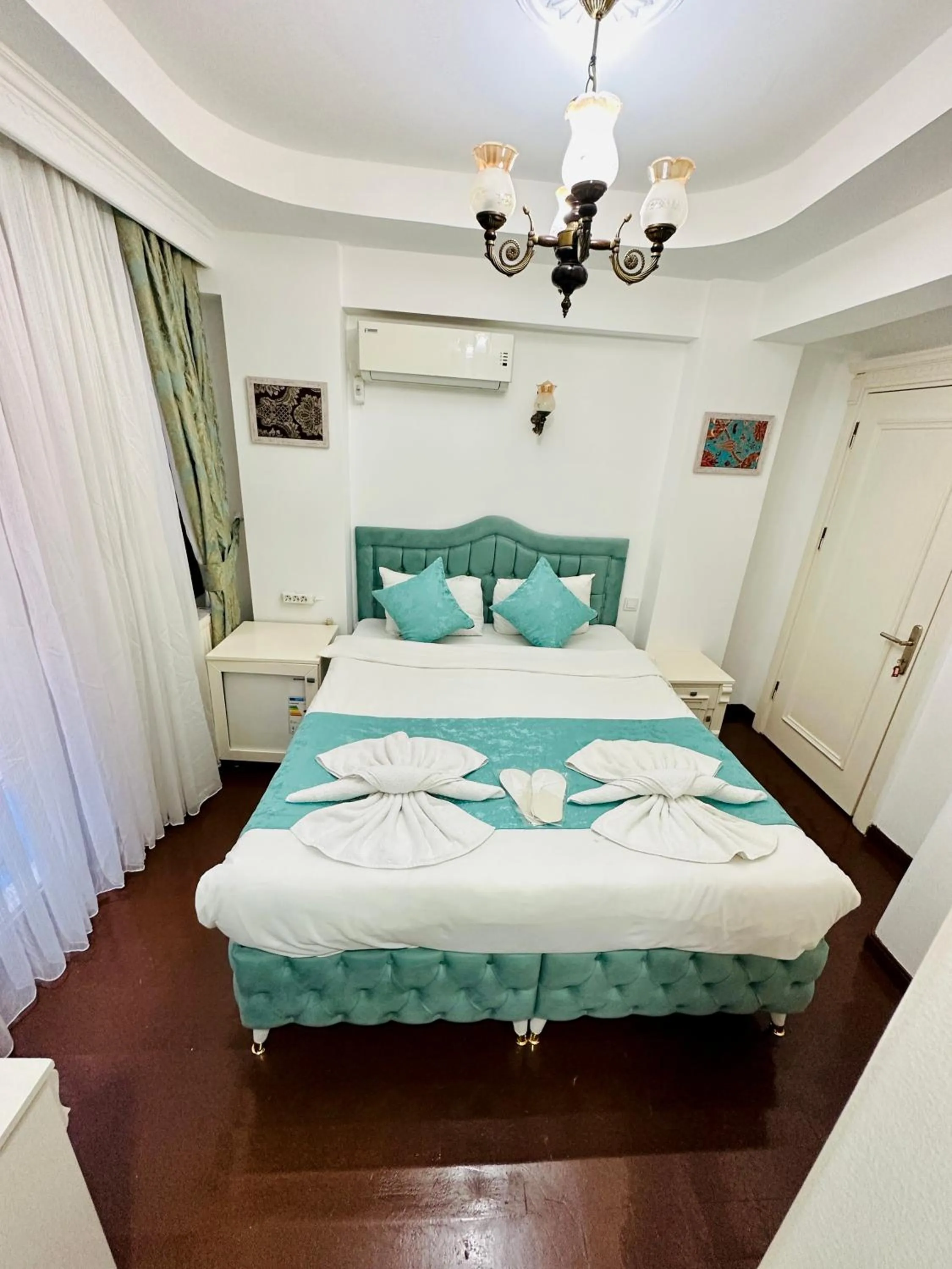 Bed in La Petite Maison Hotel