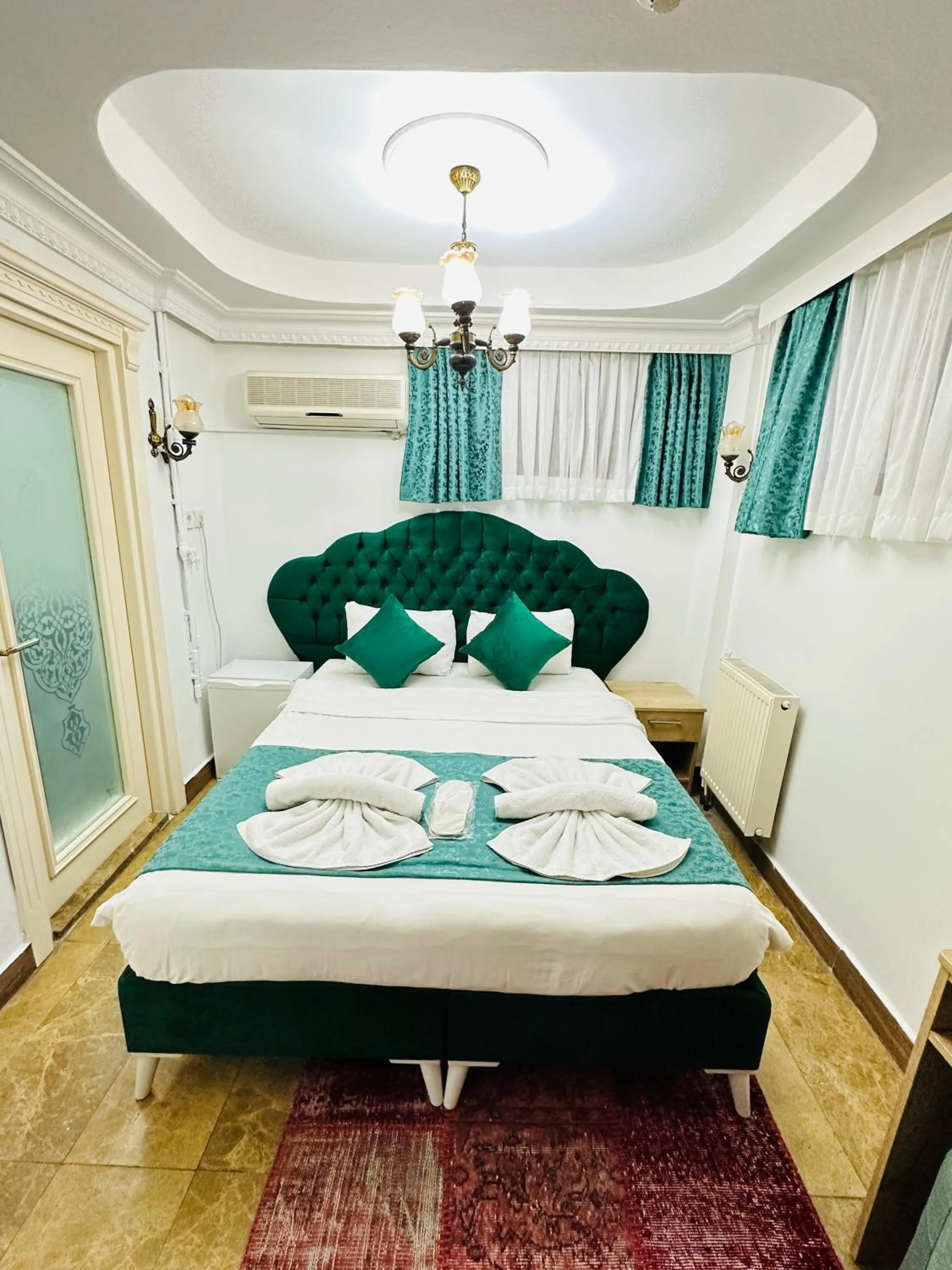 Bed in La Petite Maison Hotel