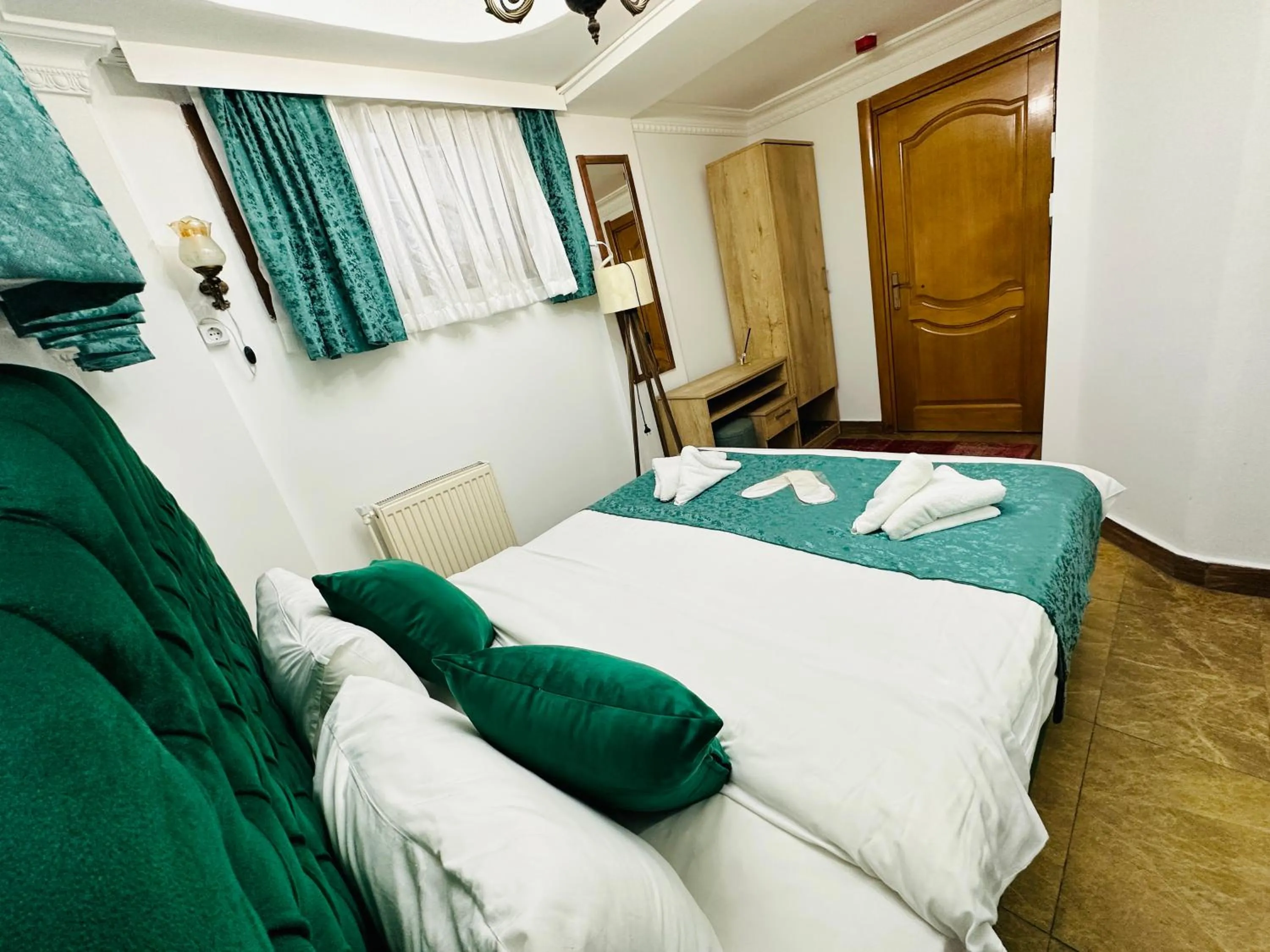 Bed in La Petite Maison Hotel