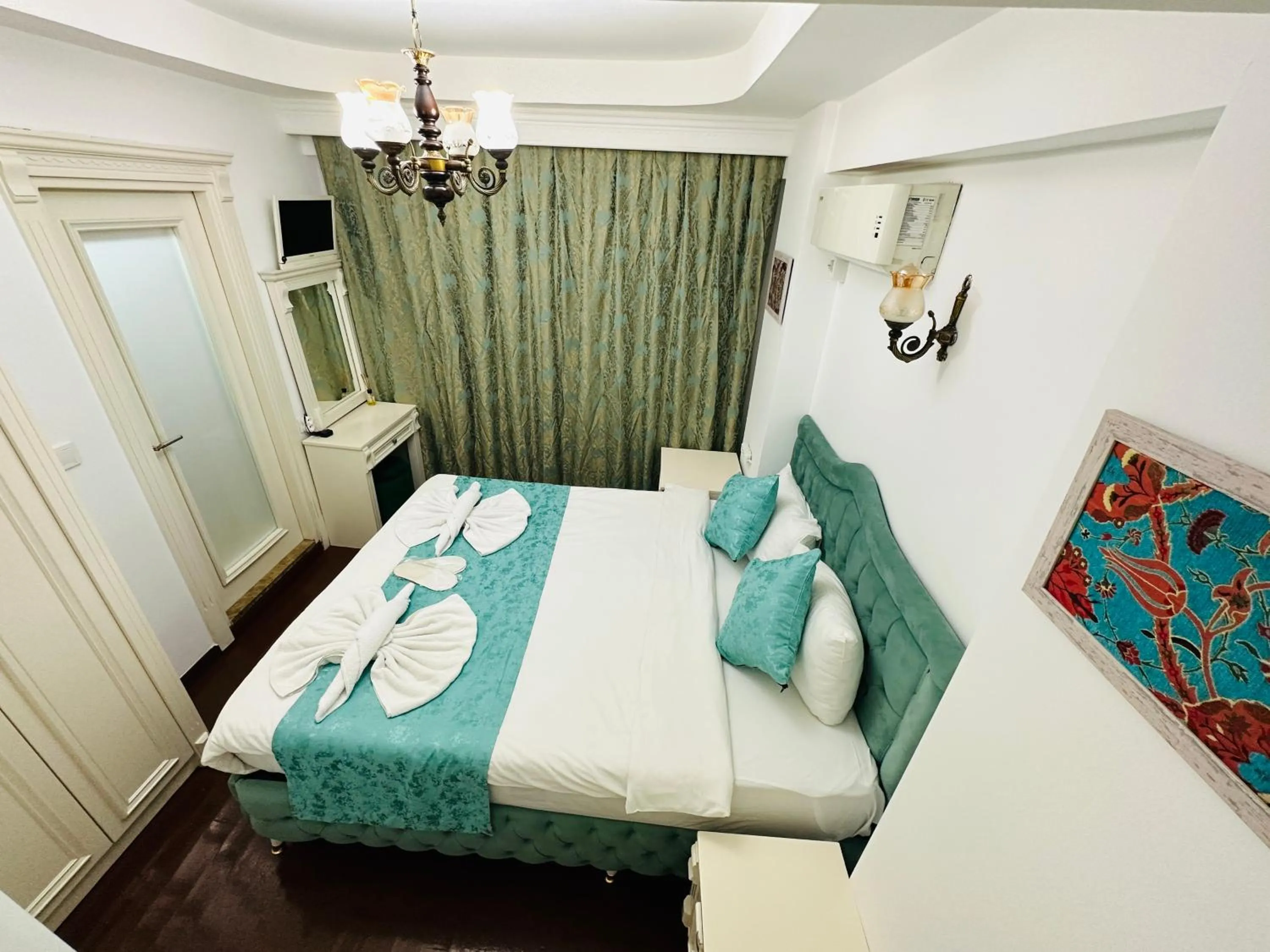 Bed in La Petite Maison Hotel