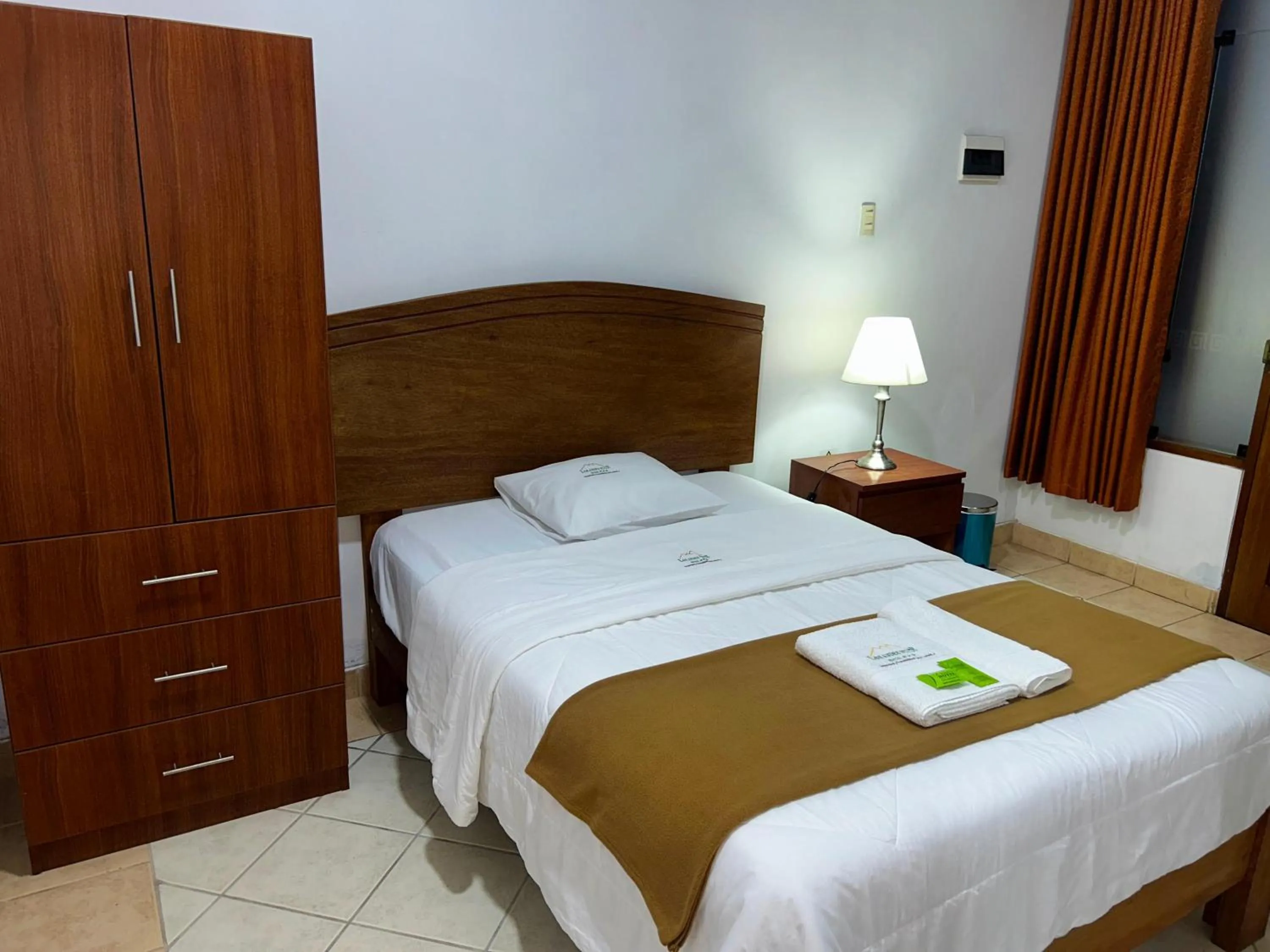 Bed in HOTEL LOS ANDES SUITE