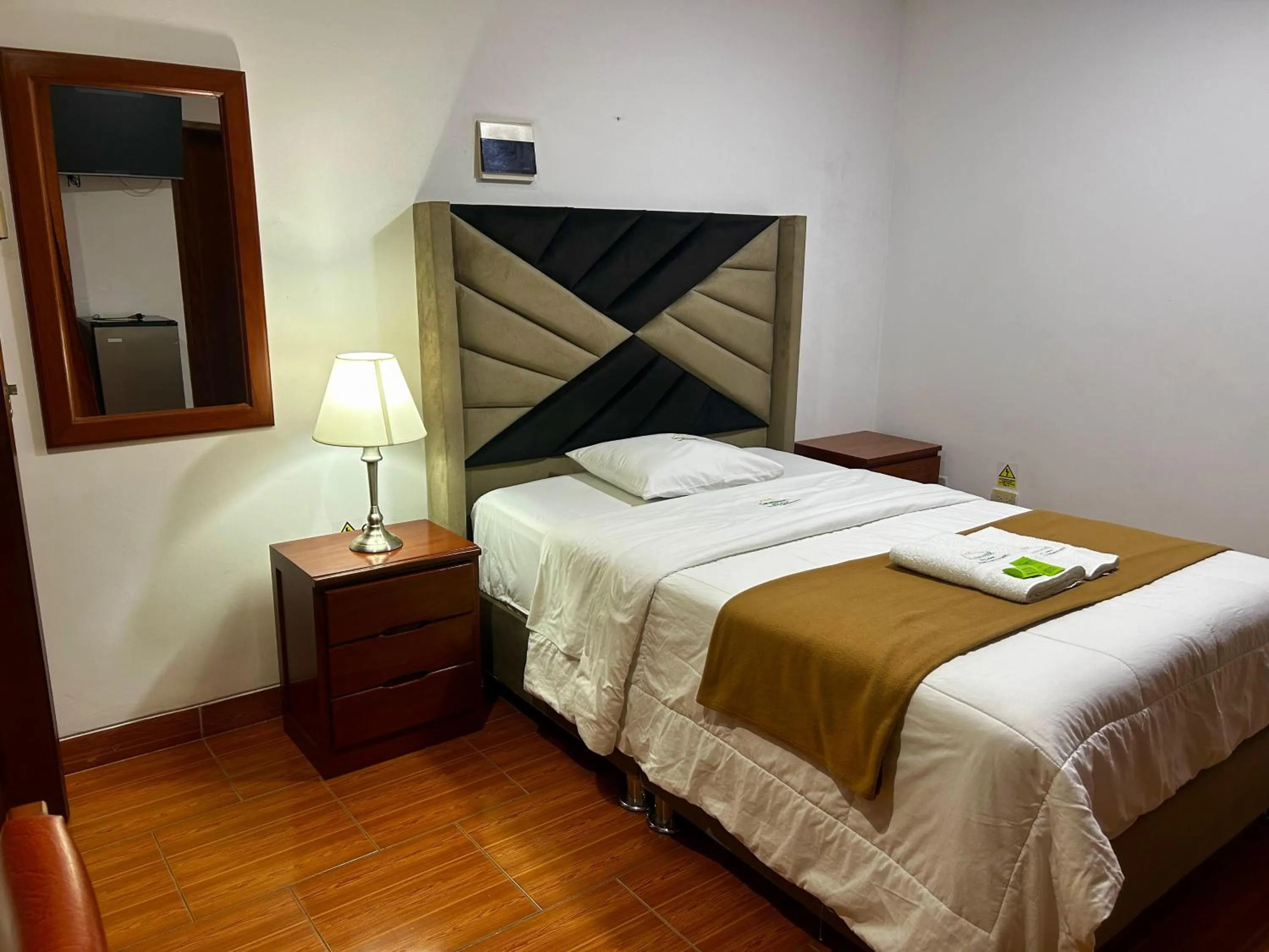 Bed in HOTEL LOS ANDES SUITE