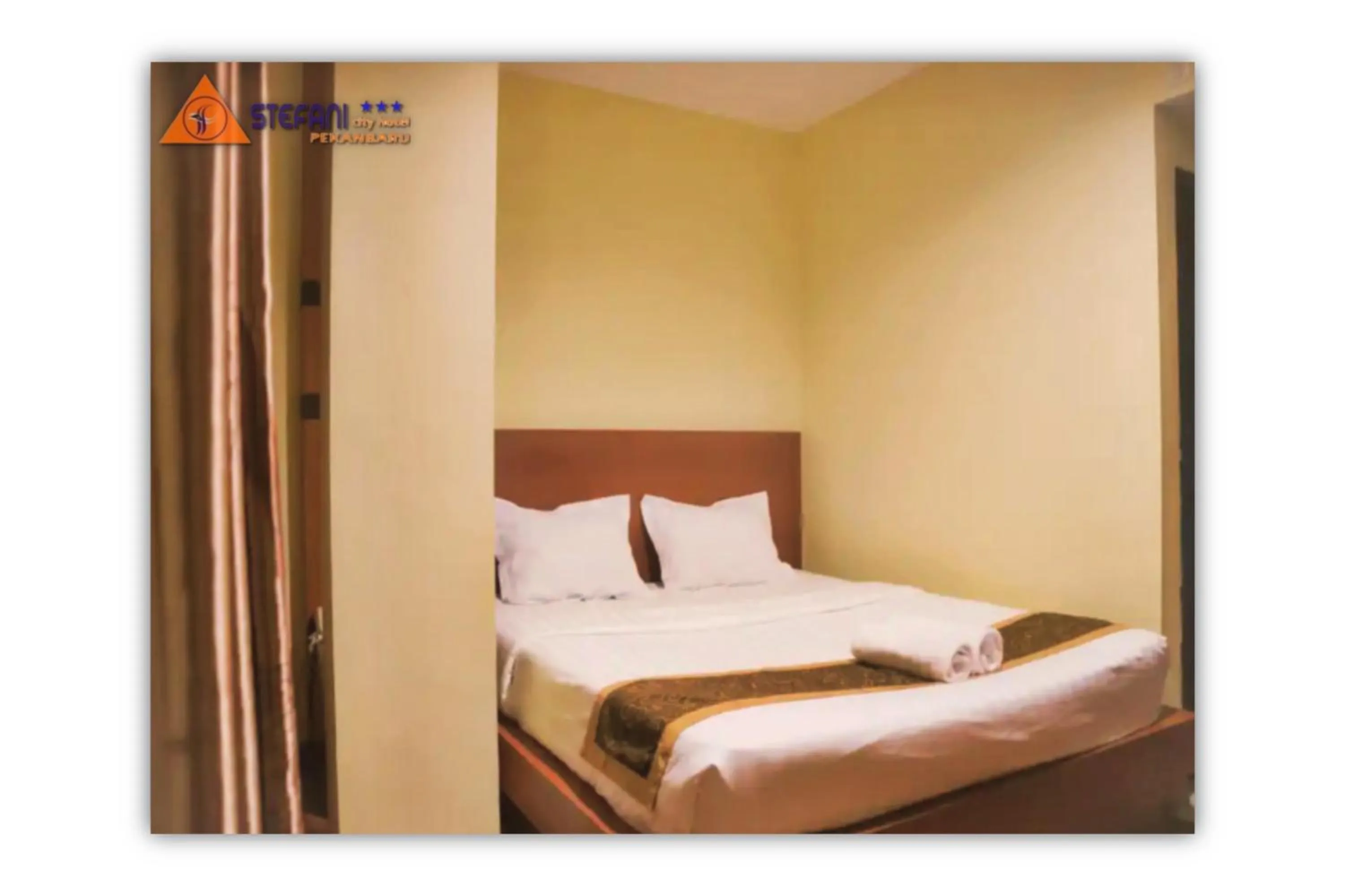 Bed in STEFANI MAKATI HOTEL